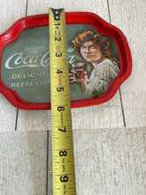 Load image into Gallery viewer, Vintage Coca-Cola tin with lady from the 20’s b84
