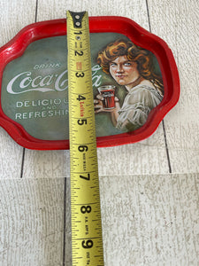 Vintage Coca-Cola tin with lady from the 20’s b84
