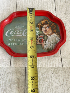 Vintage Coca-Cola tin with lady from the 20’s b84